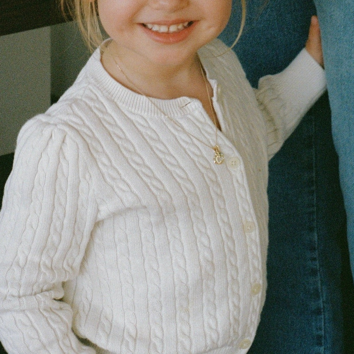 Gold initial charm on child model