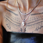 Silver tight link chain necklace on model