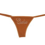 Caramel thong with "Cuchie" text in rhinestones
