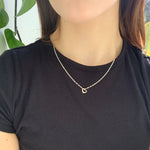 10k yellow gold Hollow Heart Shaped Charm on a Singapore Chain on model