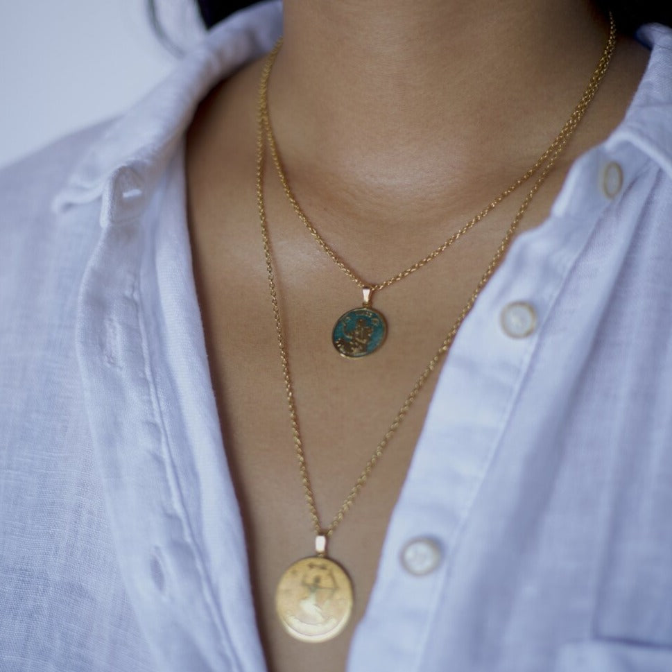 colourful zodiac pendant in gold in a thin rolo chain